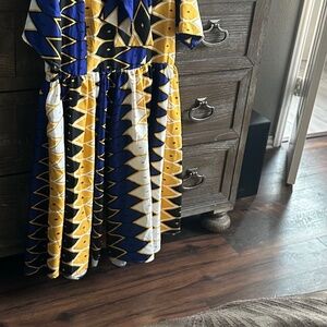 This beautiful blue and yellow Aztec Dress, features vibrant yellow/ blue color
